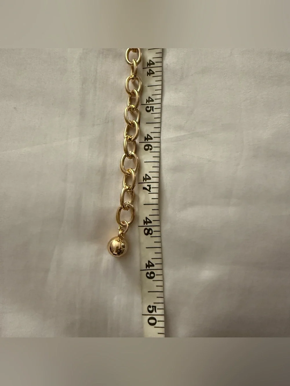 Gold tone metal chain belt with green plastic links